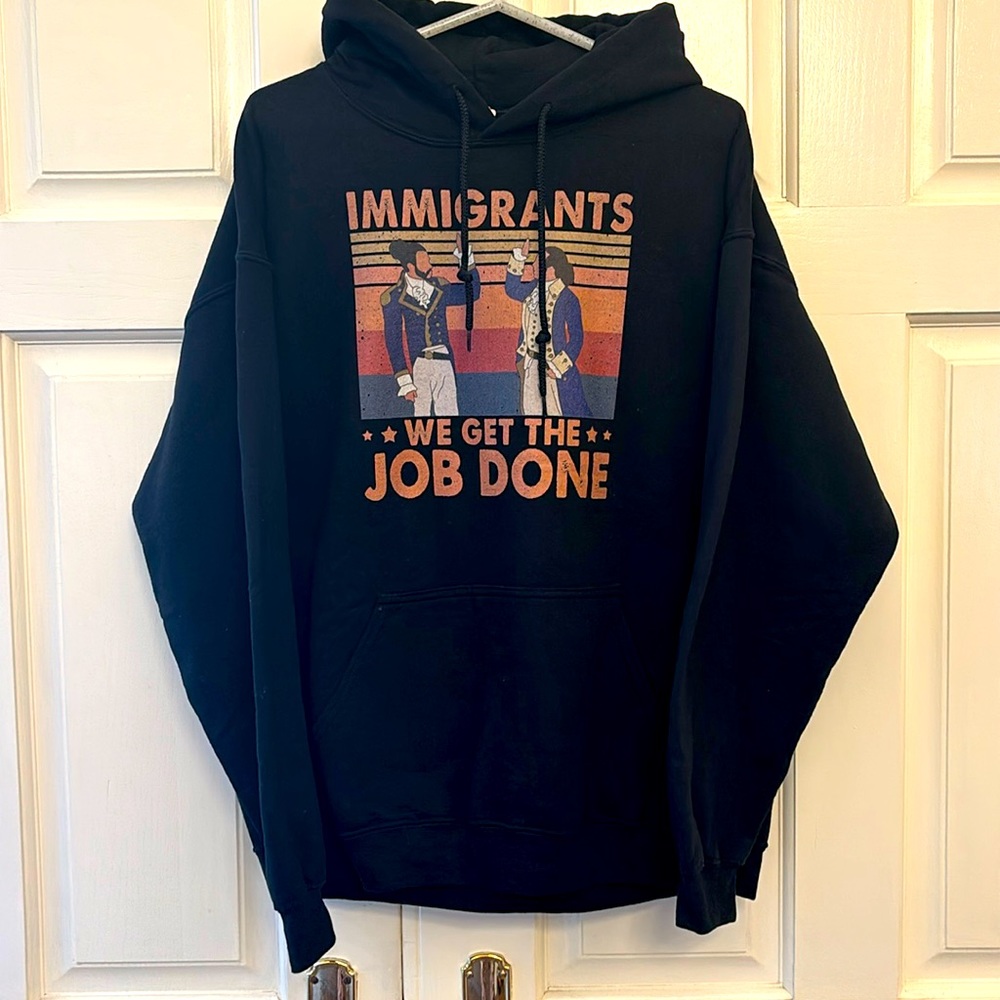Gildan Men’s or Unisex Sweatshirt Hoodie, Size L. Navy, With “Immigants” Design.